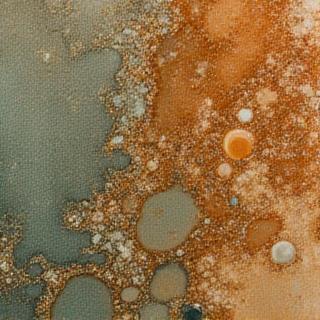 Close up of a unique stoneware glaze texture with earthy tones
